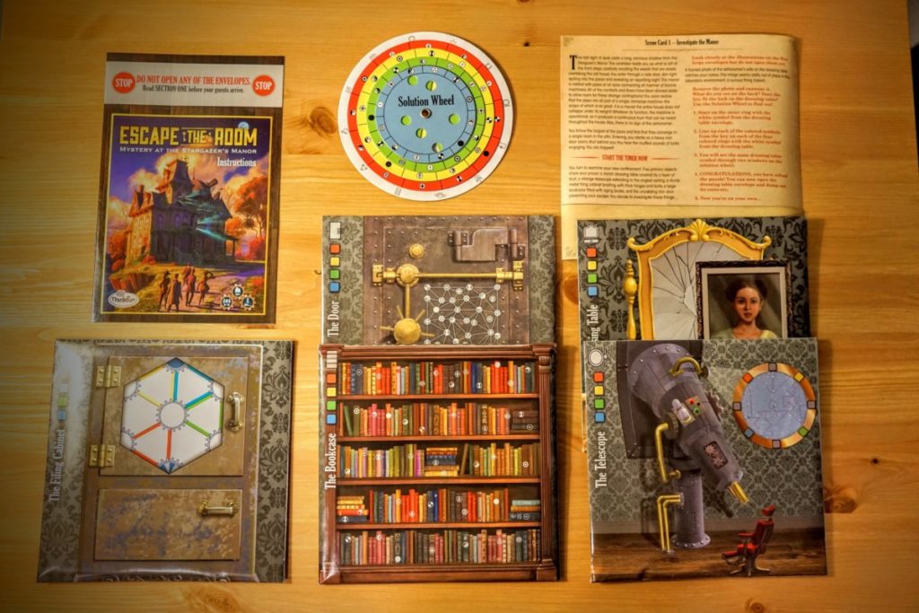All of the included materials inside the box of Mystery at the Stargazer's Manor.